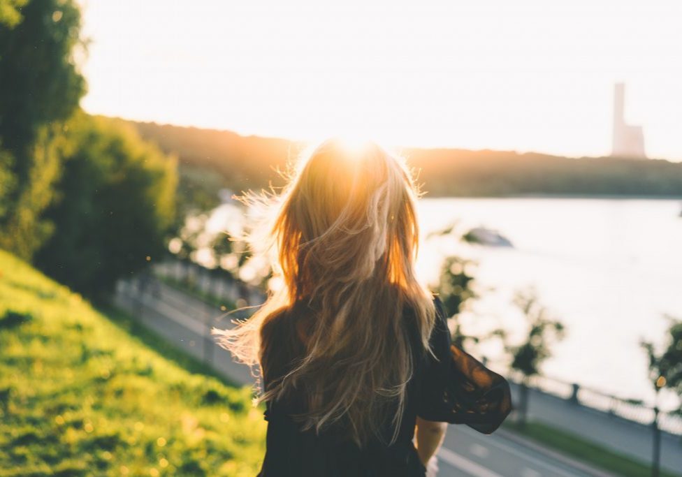 woman looking at sunset